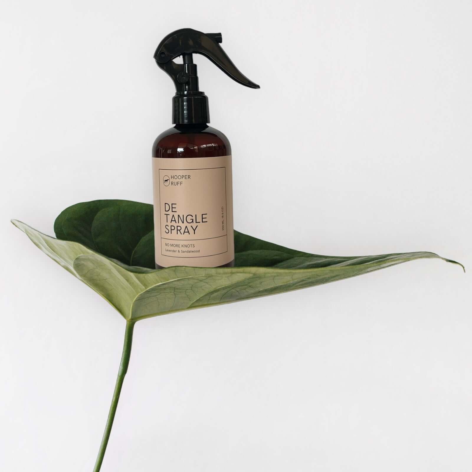 Dog detangle spray for smooth, tangle-free coats.